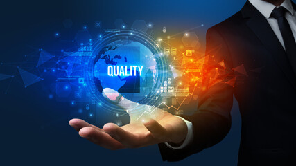 Elegant hand holding QUALITY inscription, digital technology concept