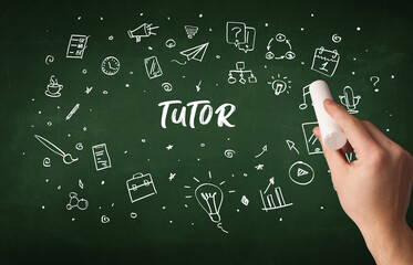 Hand drawing TUTOR inscription with white chalk on blackboard, education concept