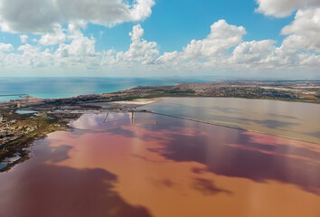 Fototapeta na wymiar Beautiful aerial photo of Salt Lake of Torrevieja during sunny day clouds reflected in salted water. Alicante province, Spain