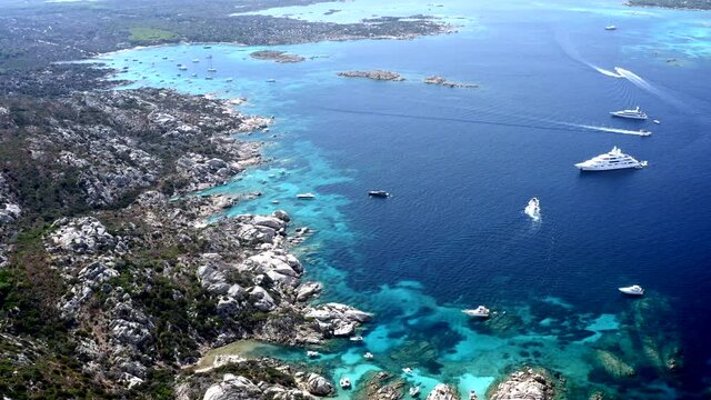 Beautiful Cinematic Aerial Drone View over Caprera Island, Sardinia, Italy.
Rocky Coastline. Turquoise Cristal Clear Sea.
