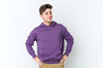 Fototapeta premium Young caucasian man isolated on white background dreaming of achieving goals and purposes