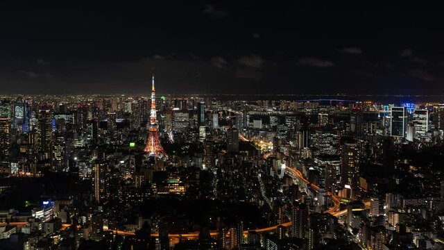 Beautiful panoramic 4k Timelapse of Tokyo night cityscape with Tokyo Tower illuminations and traffic