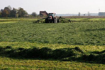 Fototapeta premium Grasernte für Silageballen. Bremen, Deutschland, Europa -- Grass harvest for silage bales. Bremen, Germany, Europe