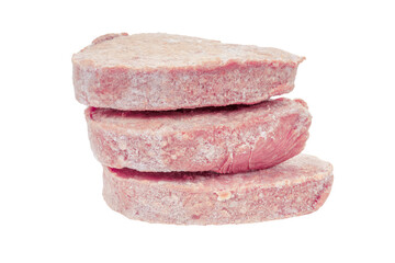 Raw frozen pork schnitzel isolated on white background.Close up