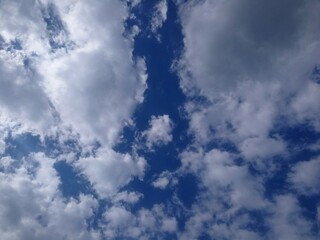 White clouds in a dark blue sky