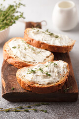 Sandwiches with cheese and thyme. Lunch with toast. Toasts on a light background