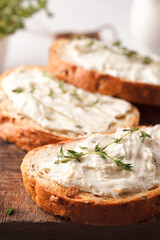 Sandwiches with cheese and thyme. Lunch with toast. Toasts on a light background