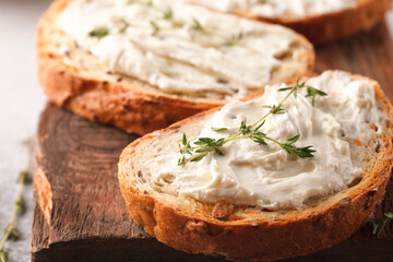 Sandwiches with cheese and thyme. Lunch with toast. Toasts on a light background