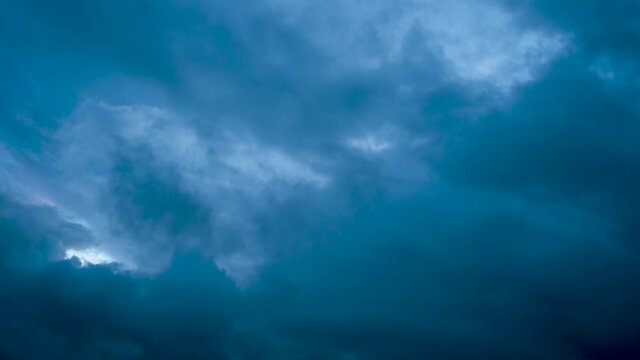 blue sky moving cloudes dark rainy day.