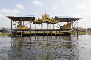 Inle Lake Myanmar 12/16/2015 with ceremonial boat under cover