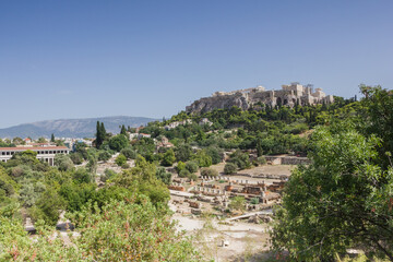 Aerial view of Athens in Greece in a sunny summer day with plenty of white houses.