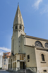 Fototapeta na wymiar View of Saint-Leon church. Saint-Leon is a parish church located in the 15th arrondissement of Paris at Place du Cardinal-Amette. France.