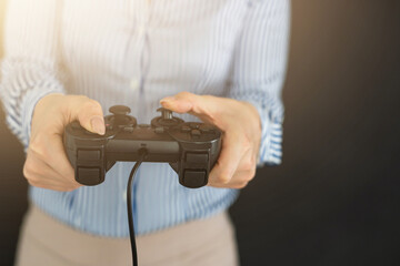 Girl playing video game with joystick.