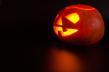 Halloween pumpkin head jack lantern on dark background