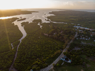 Aerial Drone shot of Chake Chake City, a Capital of Pemba island, Zanzibar archipelago. City in a river Delta at sunset time