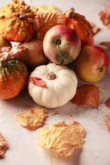 Autumn composition. Leaves and pumpkins. Halloween. The colours of autumn.Apples and leaves