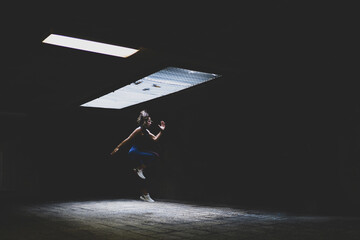 Closeup of an attractive female running and doing exercises - concept of fitness and sport