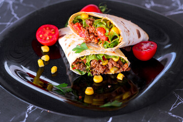 Tortilla wraps sandwiches with fresh vegetables, minced meat and on marble background. Burrito, sandwich wrap, fajita wrap