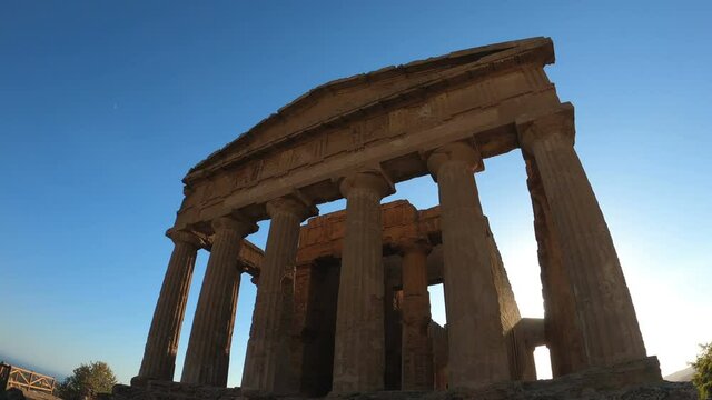suggestive view of temple of concord at sunset, valley of temples, agrigento