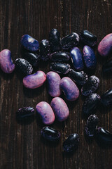 Pink and black beans on a wooden table - 380641992