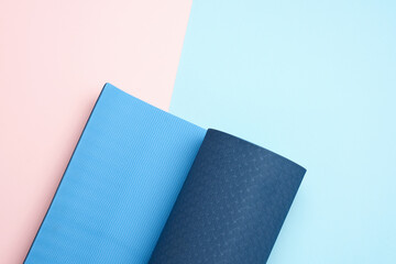 neoprene blue twisted mat lies on a pink background, sports equipment