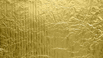 gold foil background with shiny crumpled surface for texture background