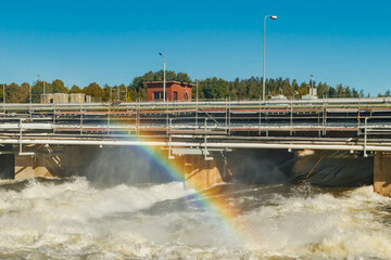 Beautiful rainbow on bypass at rapids Kuusankoski, Finland