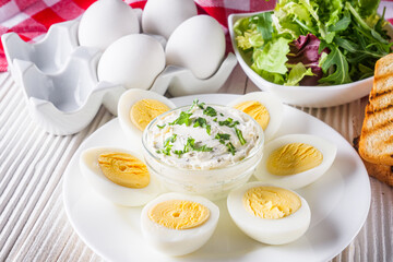 boiled chicken eggs on a white wooden rustic background