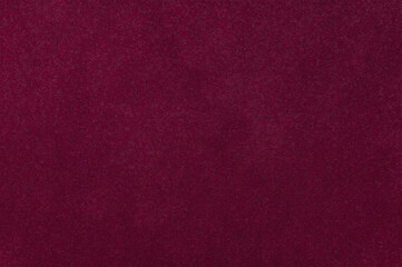 Burgundy red surface, textured wall background.