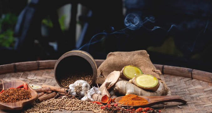 colourful spices in wooden tray. Asian popular cooking ingredients, dry hot healthy cook herbs. view form above and copy space background.