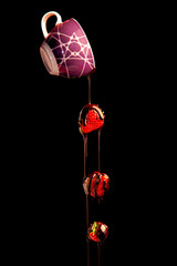 Pouring chocolate over strawberries