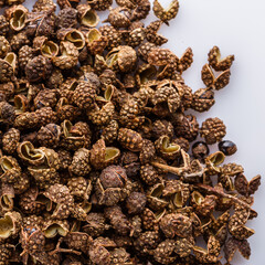 fragrant Sichuan pepper on white acrylic background