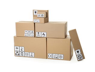 Stack of cardboard boxes with different packaging symbols on white background. Parcel delivery