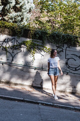 woman walking on the street in a summery outfit
