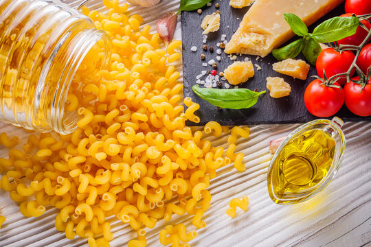 concept of traditional italian pasta with tomatoes and basil