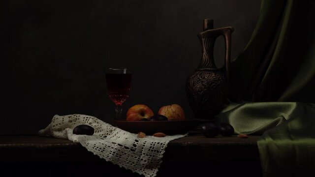 Still life with a bottle of wine, apples and plums.