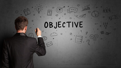 businessman drawing a creative idea sketch with OBJECTIVE inscription, business strategy concept