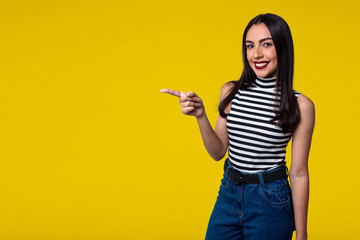 Smiling woman, isolated on yellow background with space for text