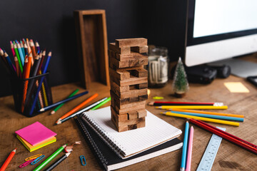 Desk Stationery on the desk, colored books and toys.