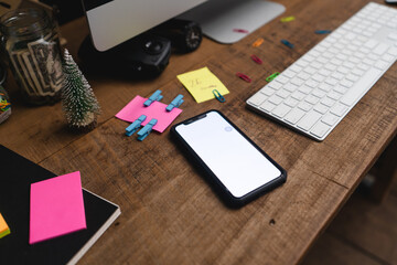Smartphones on the desk and green devices, smart phone mockups
