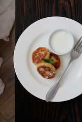 Traditional homemade dessert syrniki. Cheese pancake. Top view