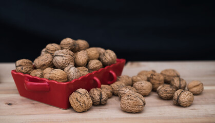 Walnuts on wooden table. Autumn harvest of nuts.

