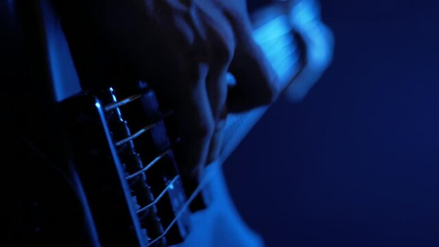 bass guitar player at a live show CLOSE UP ON BASS