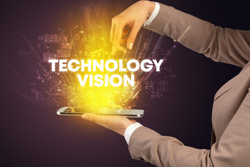Close-up of a touchscreen with TECHNOLOGY VISION inscription, innovative technology concept