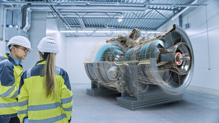 Industry 4.0: Two Engineers Standing, Talking in Factory Workshop with Augmented Reality 3D Turbine...