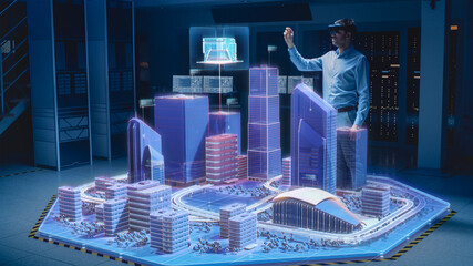 Industry 4.0: Modern Professional Architect Wearing Virtual Reality Headset Uses Gestures to...