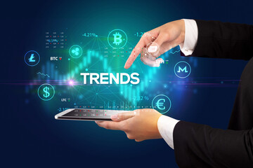 Close-up of a touchscreen with TRENDS inscription, business opportunity concept