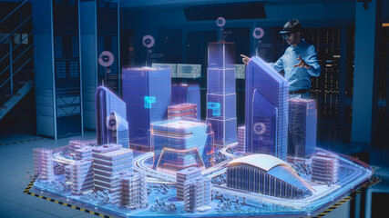 Industry 4.0: Modern Professional Architect Wearing Virtual Reality Headset Uses Gestures to Move, Design, Manipulate Buildings for 3D City. Mixed Augmented Reality Software. VFX Special Visual Effect