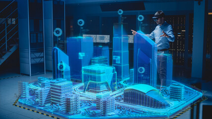 Industry 4.0: Modern Professional Architect Wearing Virtual Reality Headset Uses Gestures to...