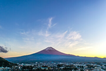 Fototapeta premium Aerial view over lake Kawaguchi, located in the border Fujikawaguchiko and Minobu, southern Yamanashi Prefecture near Mount Fuji, Japan. Lake Kawaguchi is a very popular tourist spot near Fuji Japan.